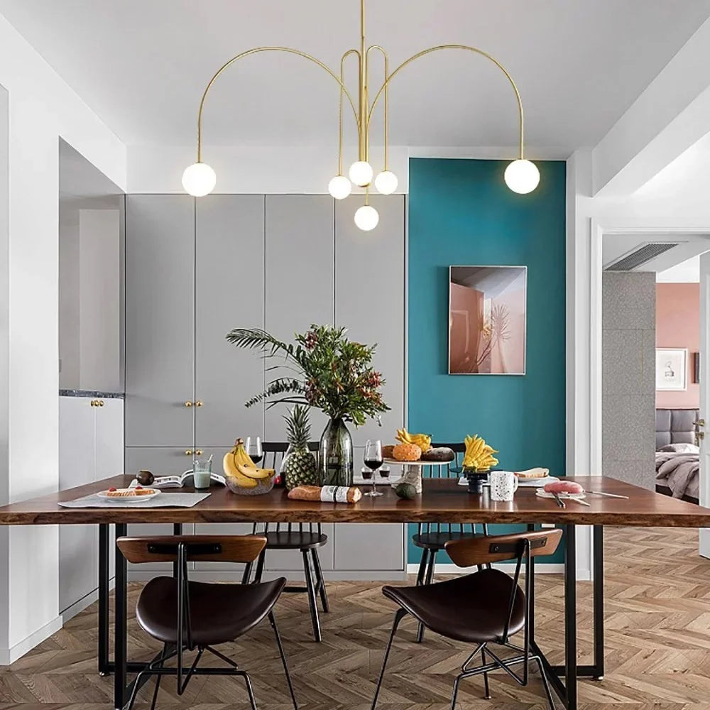 Copper-plated multi-arm chandelier with five white globe bulbs and arched metal arms
