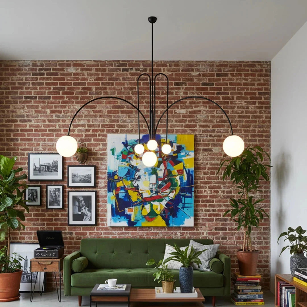 Multi-arm chandelier with black metal frame and round orb glass shades