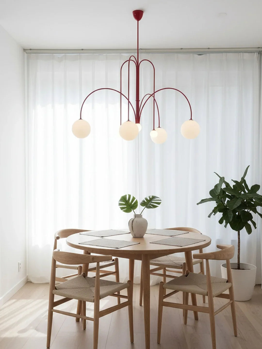 Red multi-arm chandelier with five white globe bulbs and slender arched metal frame