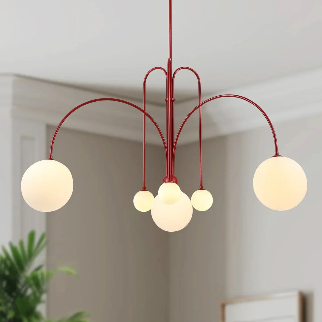 Multi-arm chandelier with red metal frame and glowing round orb glass shades