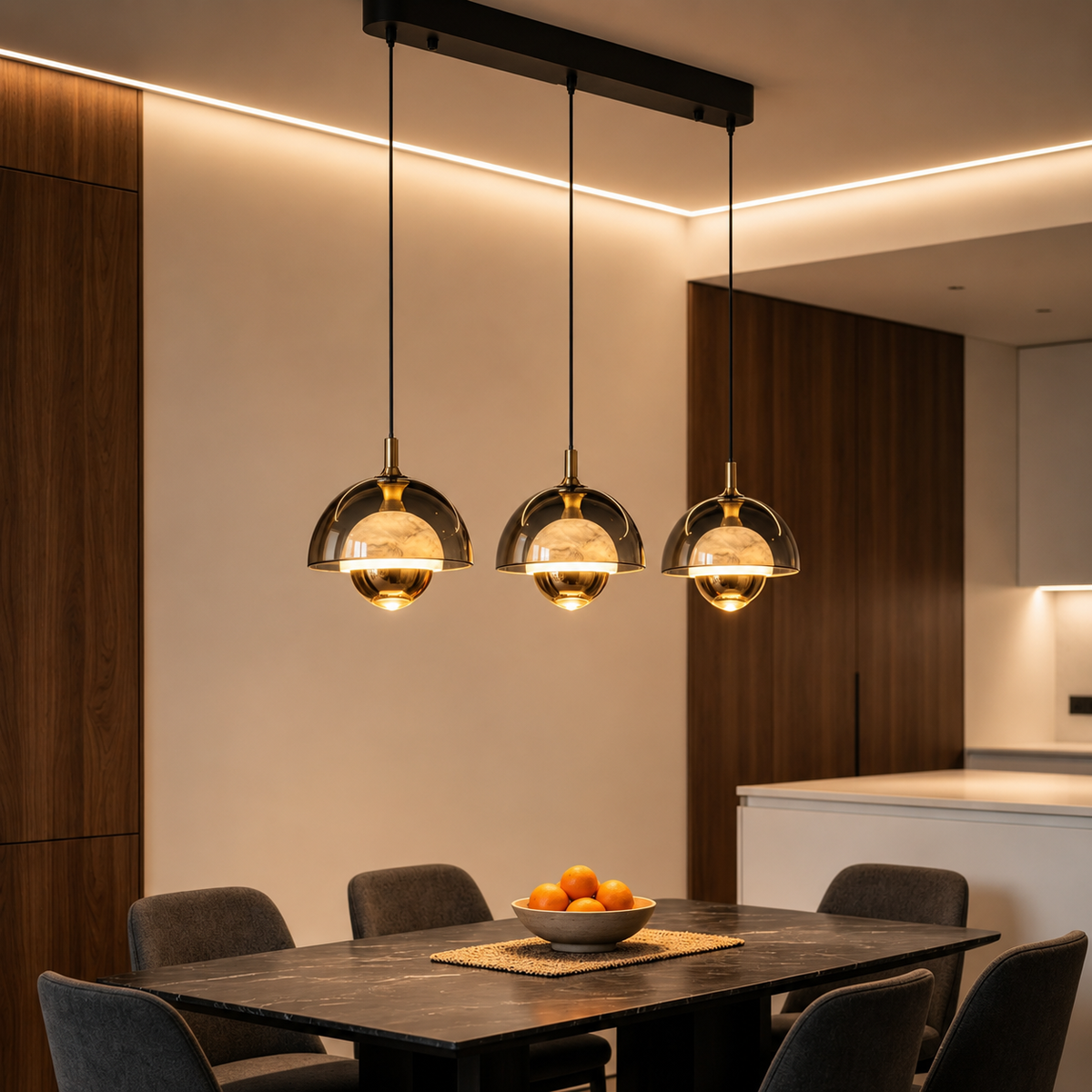 Three bronze pendant lights with curved glass dome shades on a black bar