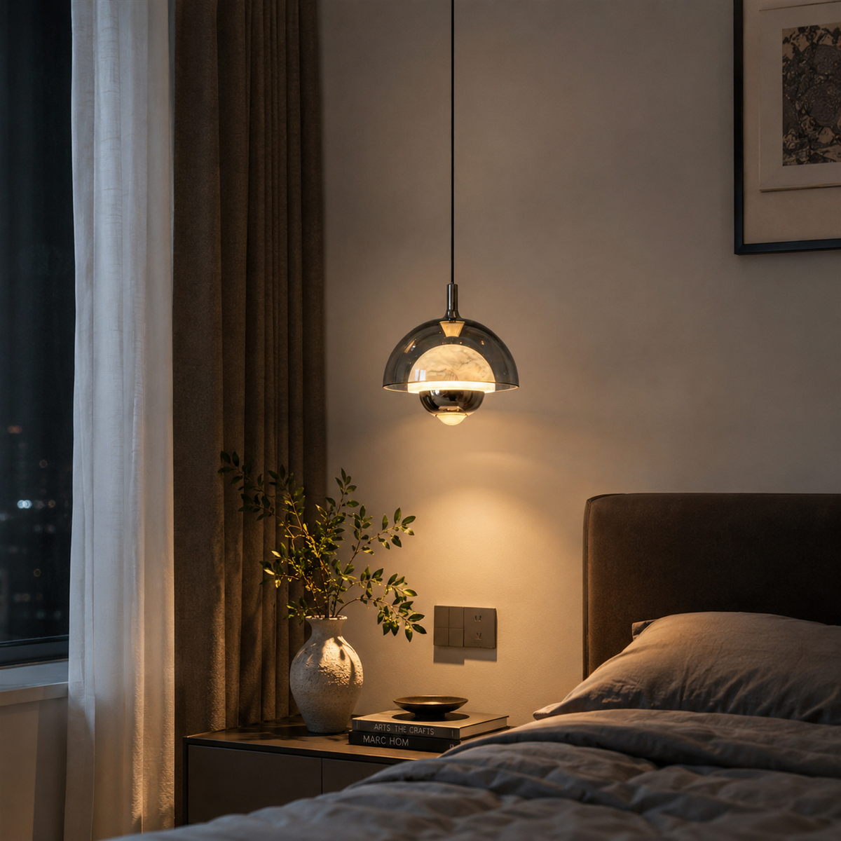 Single bronze pendant light with curved glass dome shade and hanging cord