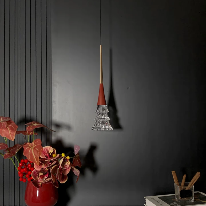 Ruby red rise-and-fall pendant light with crystal tree diffuser, lit warm