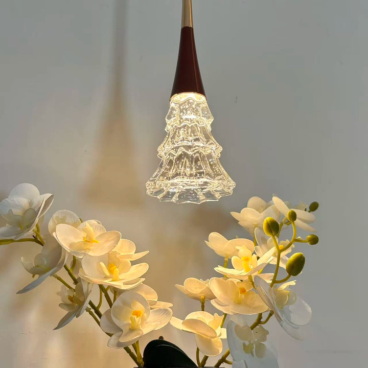 Champagne gold pendant light with crystal tree diffuser, lit warm glow