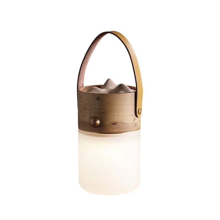 Leather handle table lamp with dark wood-brown base and warm white cylindrical shade