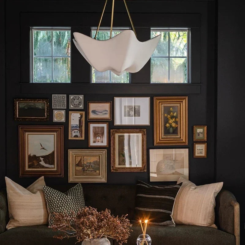 Chalk white plaster chandelier with scalloped bell shade and gold hanging chain