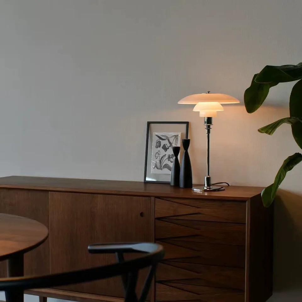 White dome glass table lamp with layered dome shades on a chrome base