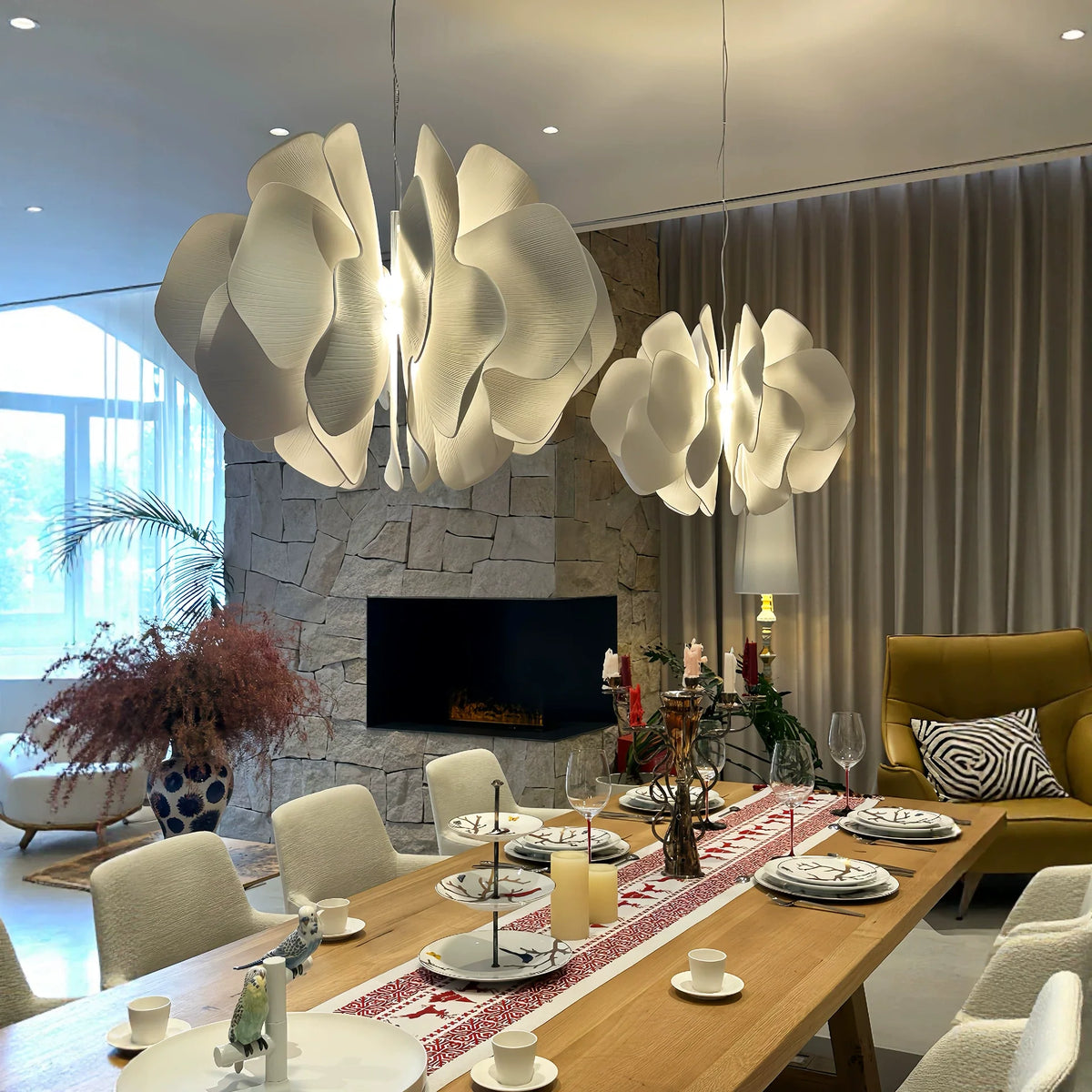 Nightbloom ceramic petal chandelier with two hanging white petal clusters, warm glow