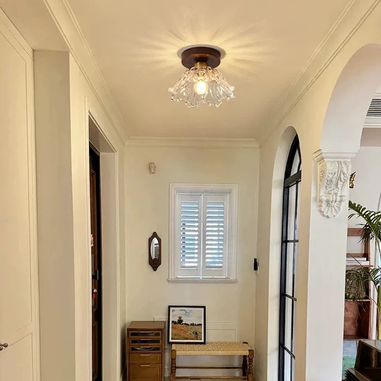 Semi-flush ceiling light with clear petal glass shade and brown canopy