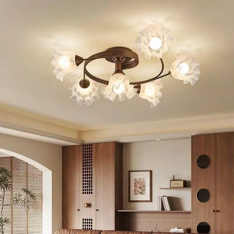 Coffee-toned semi-flush chandelier with floral frosted glass shades and curved arms