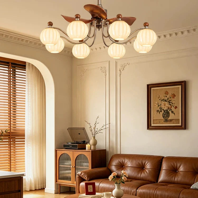 Close view of bronze 8-light ceiling fan chandelier with frosted glass shades
