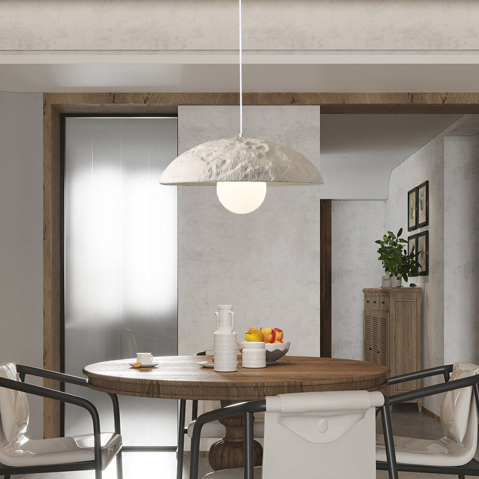 Ivory dome pendant light with textured dome shade and central hanging downrod