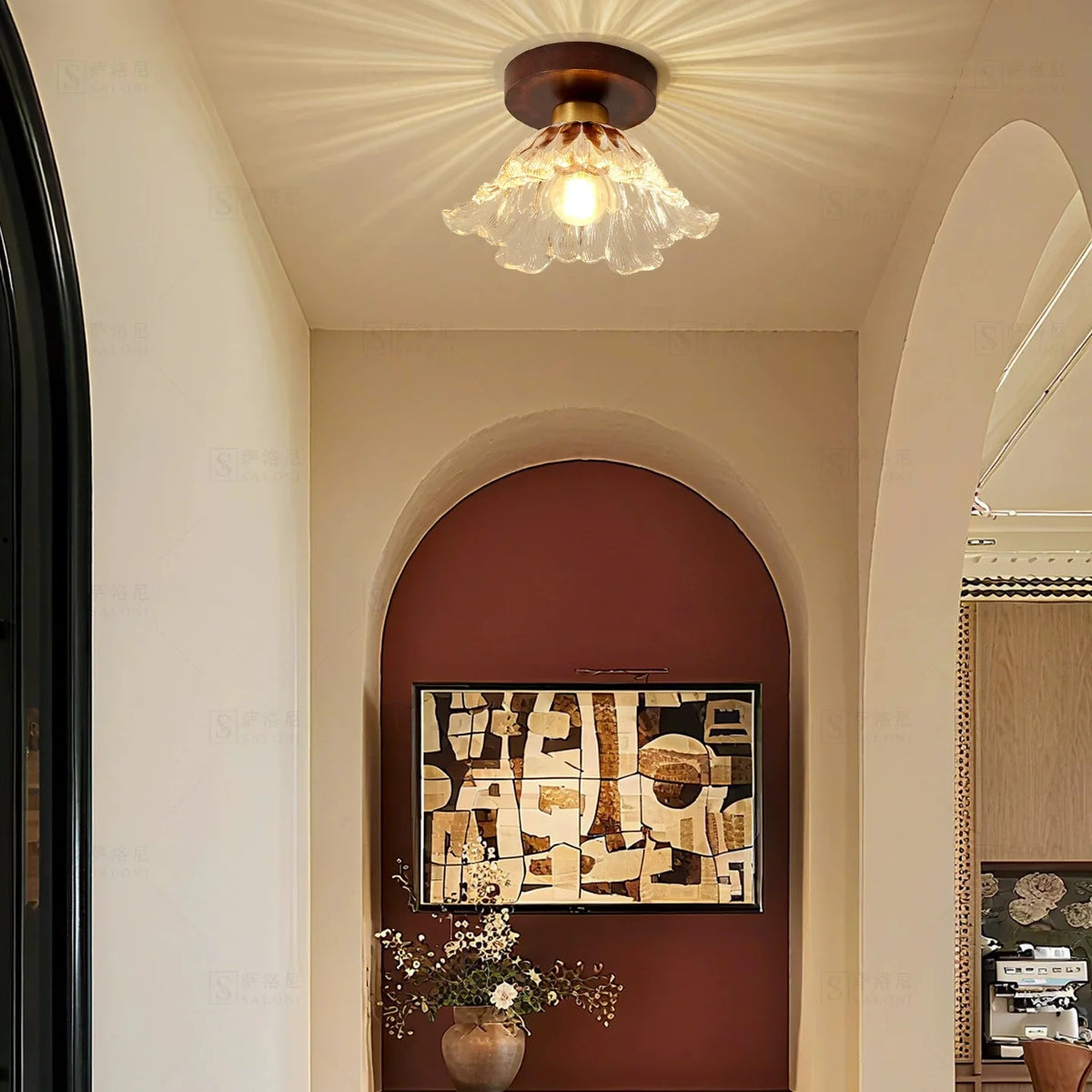 Semi-flush ceiling light with clear petal glass shade and warm amber bulb