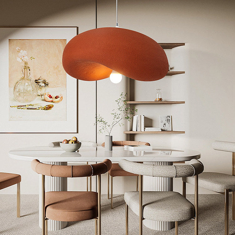 Warm coral organic disc pendant light with textured fabric disc shade and cord