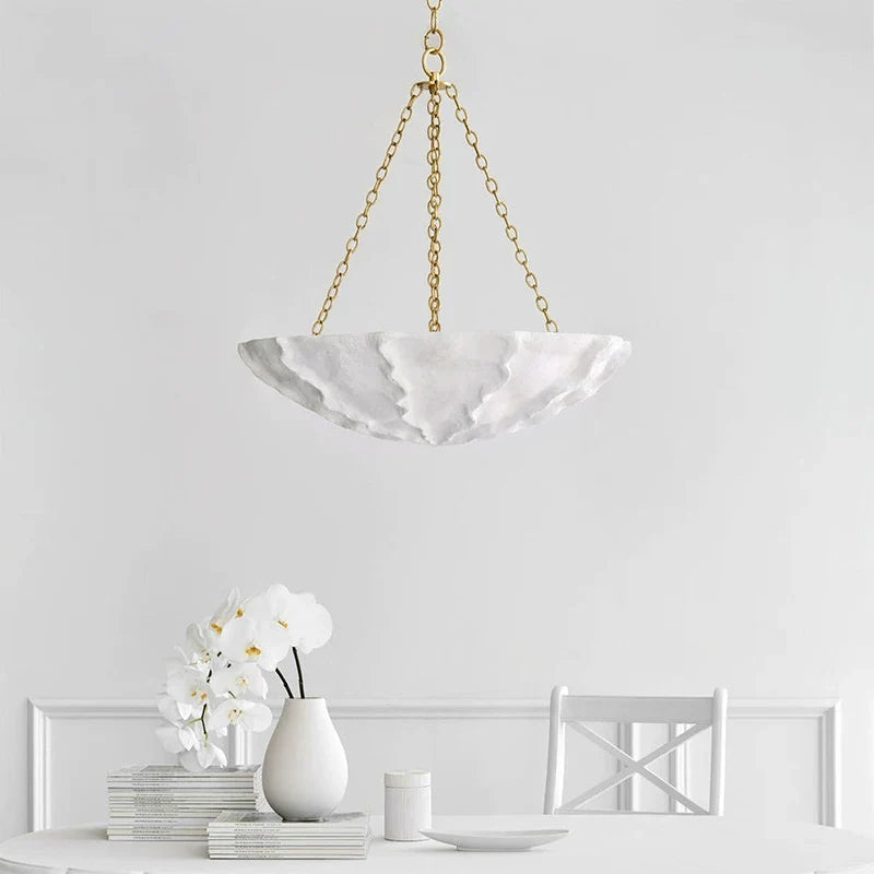Petal-shaped chandelier shade with white finish and gold-tone hanging chain