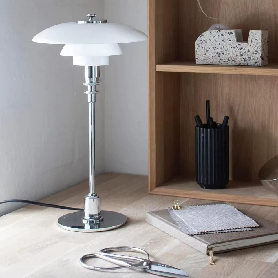 White dome glass table lamp with chrome stem, stacked rings, and layered dome shades