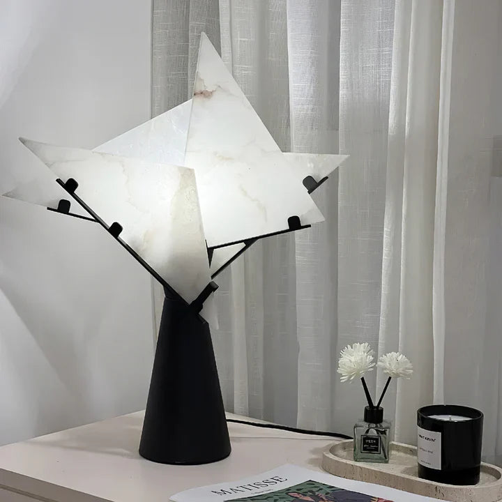 Black table lamp with alabaster star shade and black pedestal base