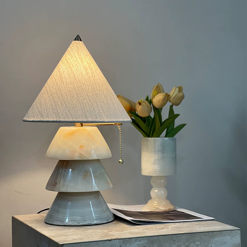 Carved jade-style tree table lamp with pale blue carved base and cream fabric shade