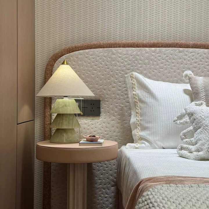 Carved jade-style tree table lamp with three stacked conical shades and brass base.