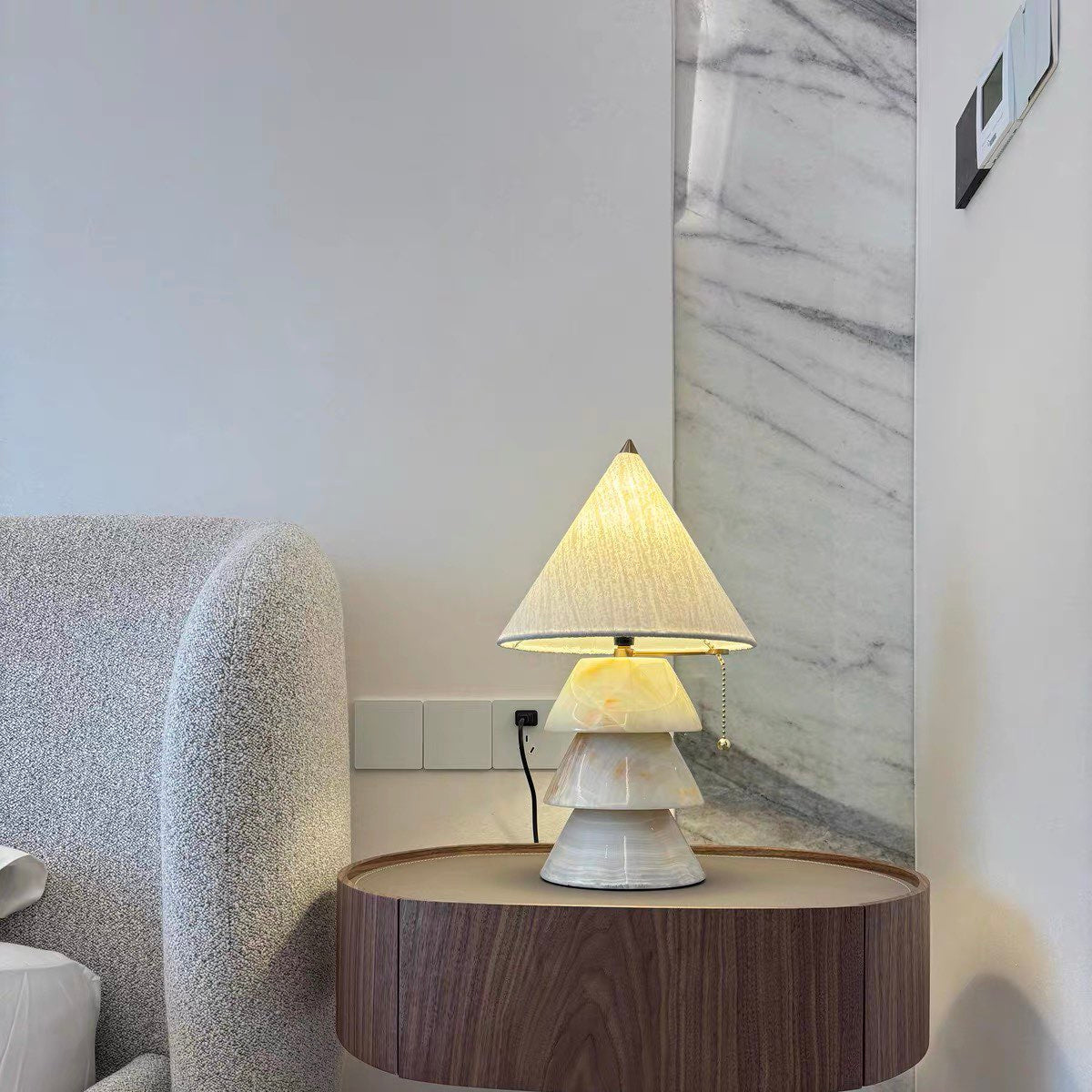 Carved jade-style tree table lamp with stacked conical shades and brass finial.