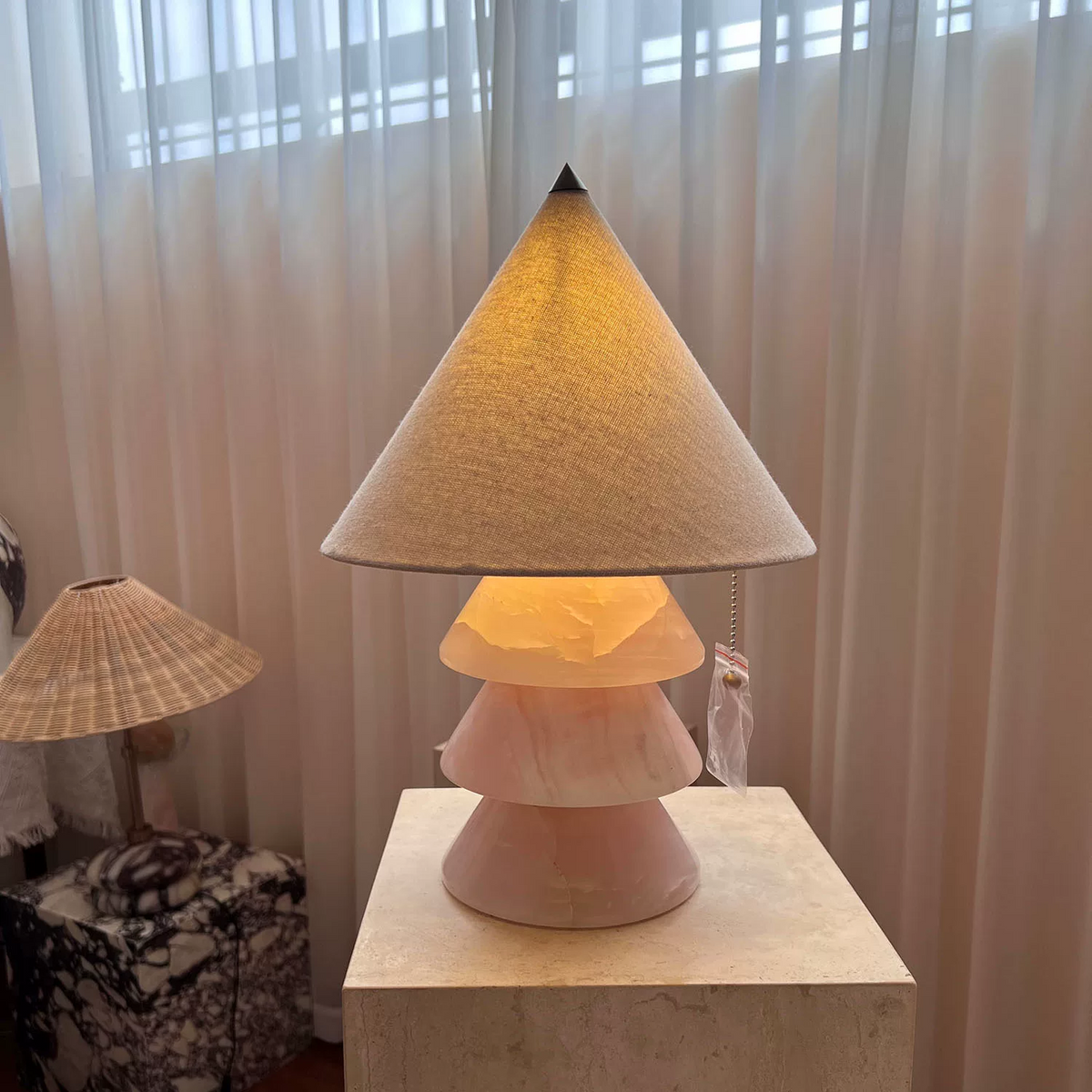 Carved jade-style tree table lamp with stacked conical shades and brass top finial.