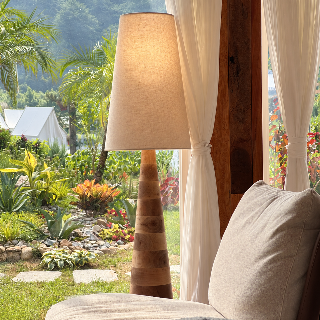 Tapered wood floor lamp with beige drum shade and carved column base