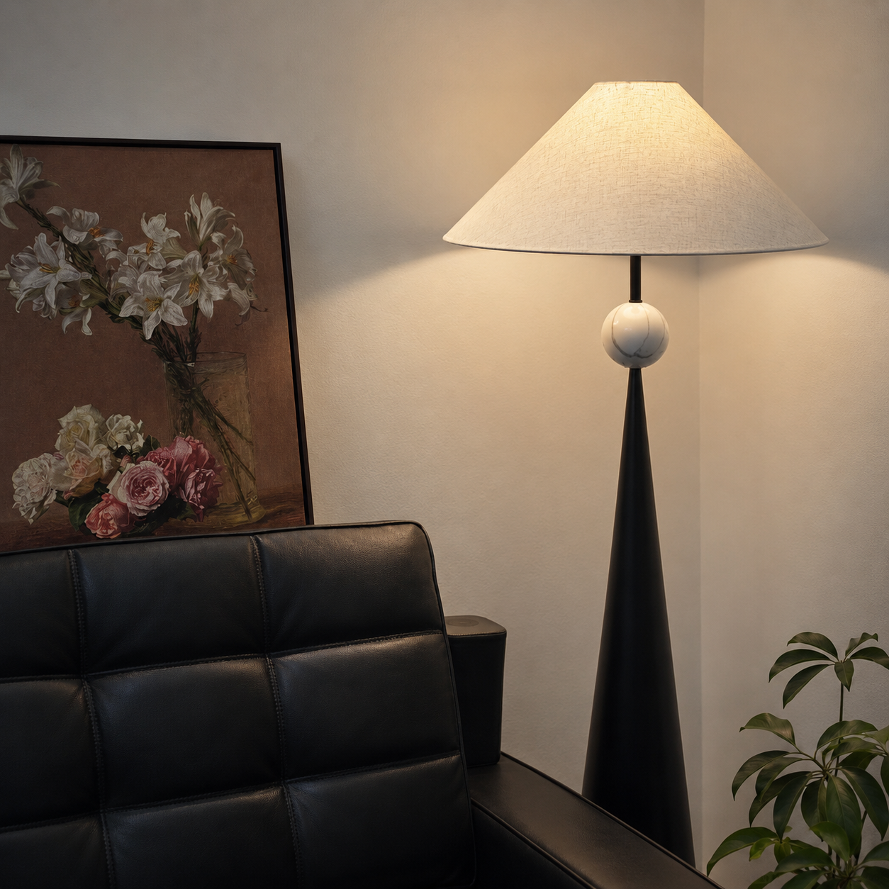Black floor lamp with white linen shade, round knob accents, and tapered pedestal base