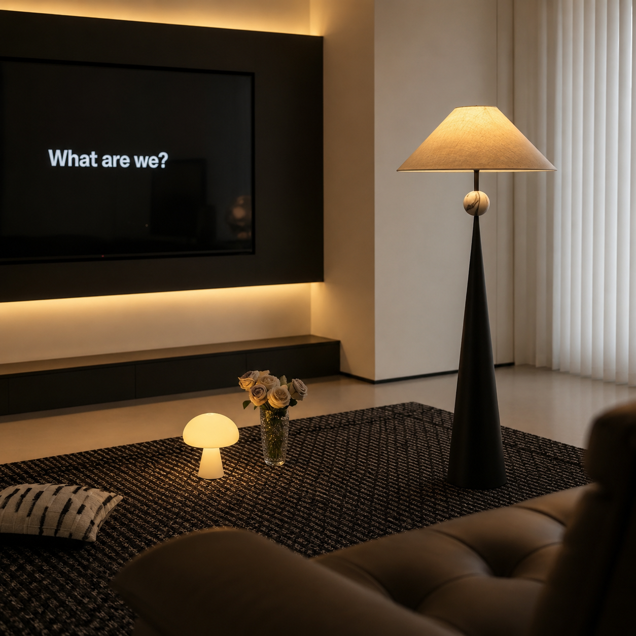 Black standing floor lamp with beige linen shade and spherical mid finial.