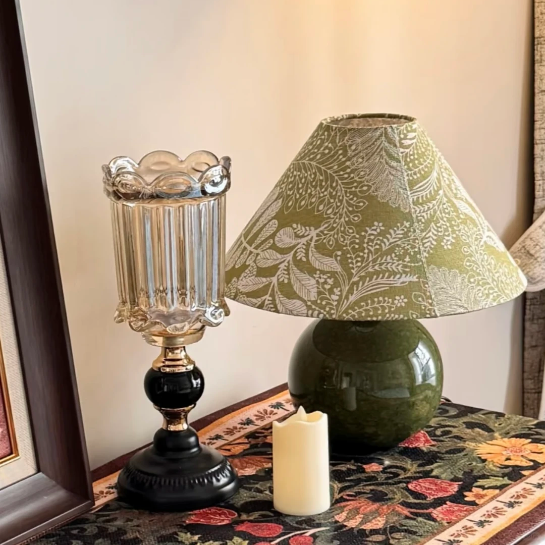 Botanical ceramic table lamp with green globe base and green-gold patterned shade