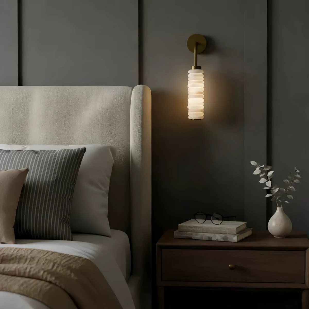 Single tiered alabaster wall sconce with cylindrical stacked shade and round brass top