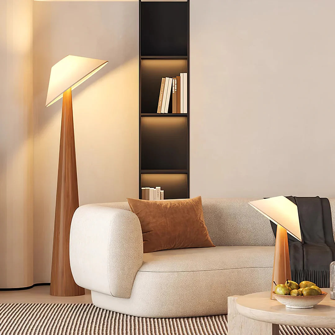 Cone-shade floor lamp with tall natural wood stem and wide flared shade top.
