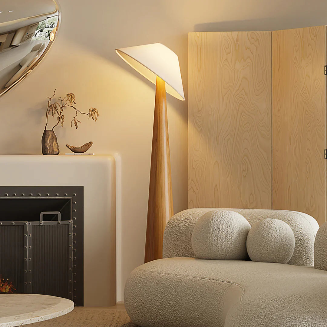Natural wood cone-shade floor lamp with slim tapered stand and angled shade.