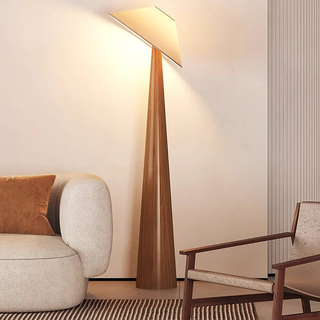 Tall natural wood floor lamp with cone shade and tapered standing base.