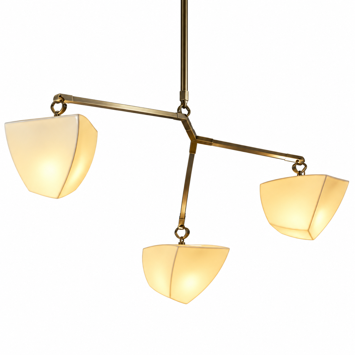 Brass branching chandelier close-up showing frosted white shades and chain links