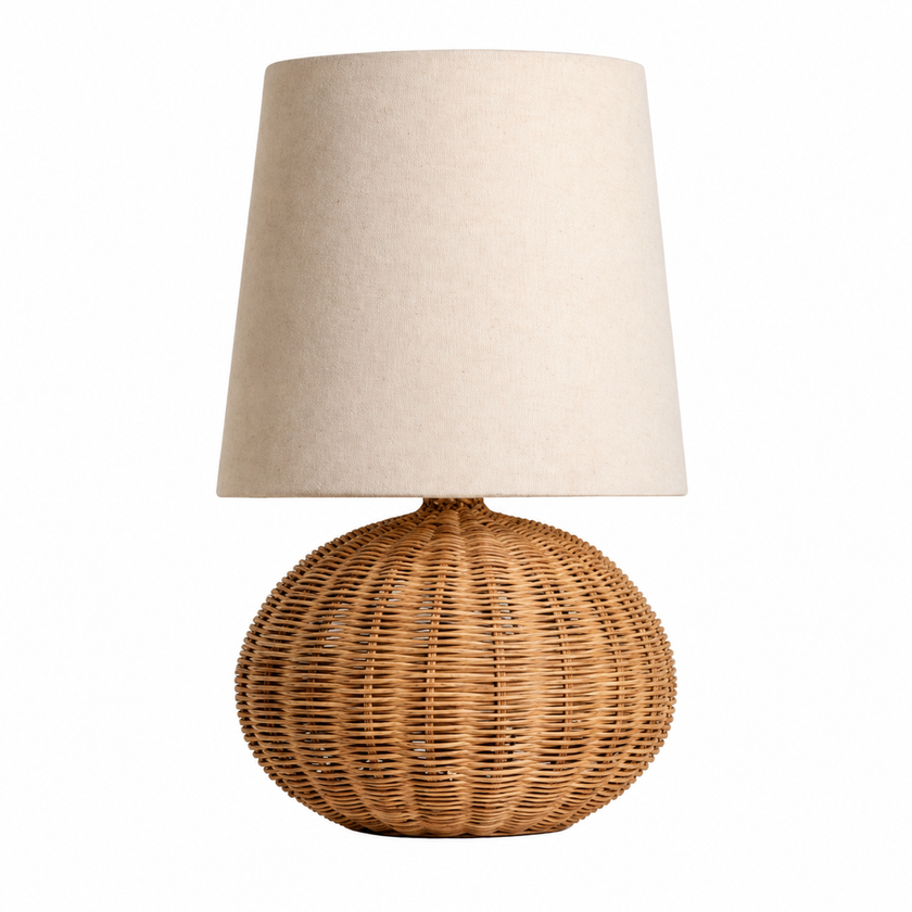 Wabi Rattan table lamp with beige fabric drum shade and woven round rattan base.