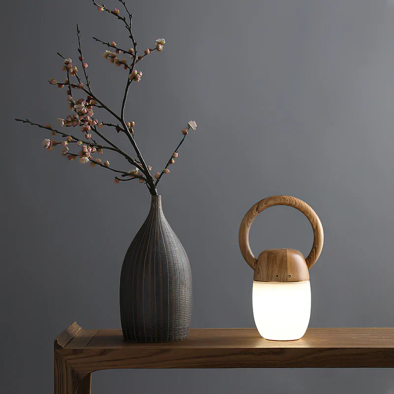 Wood ring-handle tabletop lantern with frosted white glass glow