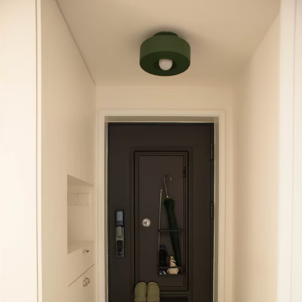 Green resin flush mount ceiling light with round shade and soft glowing center