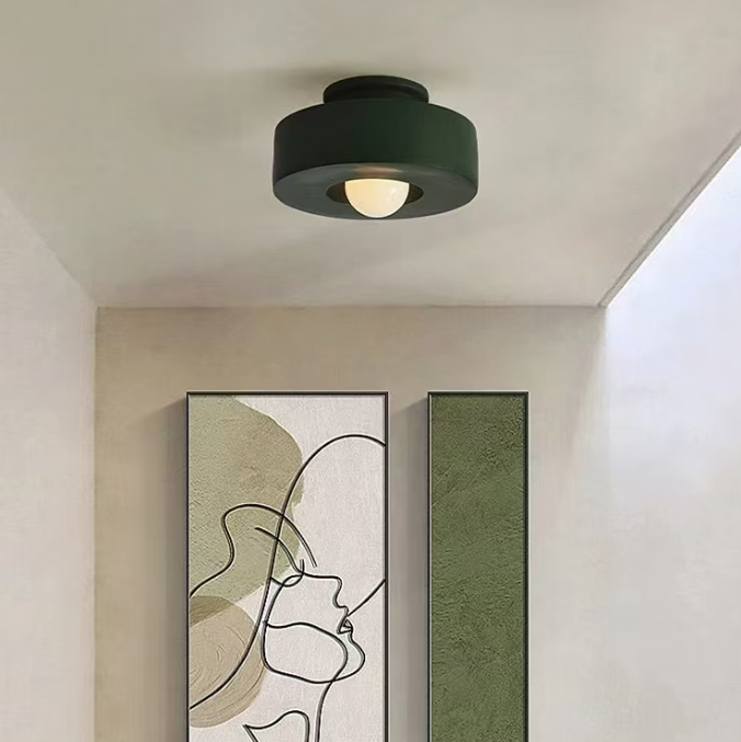 Green resin flush mount ceiling light with round shade and warm central glow