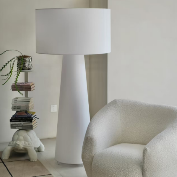 Fabric floor lamp with white drum shade and tall cylindrical base