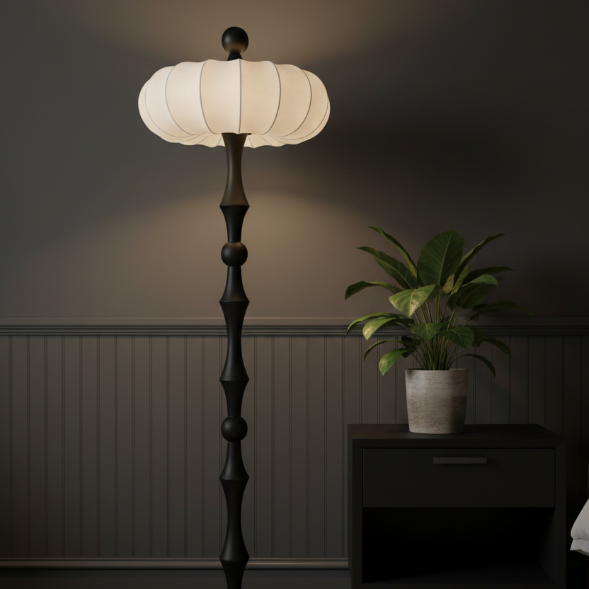 Standing floor lamp with cream ribbed drum shade and dark segmented base
