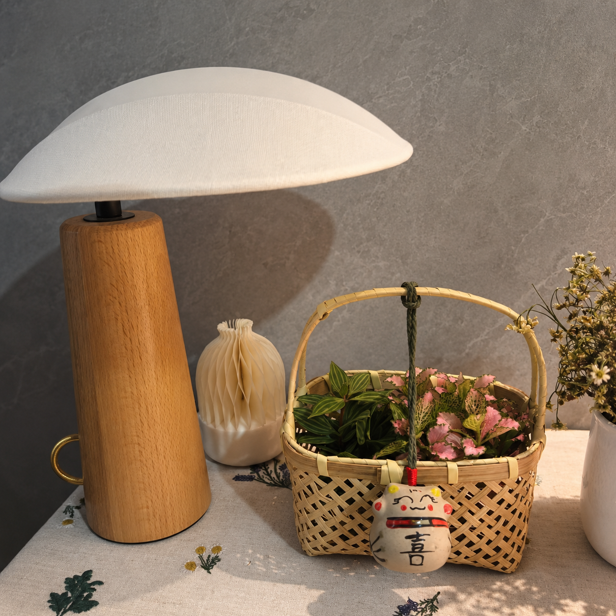 Wood table lamp with linen shade and black center stand