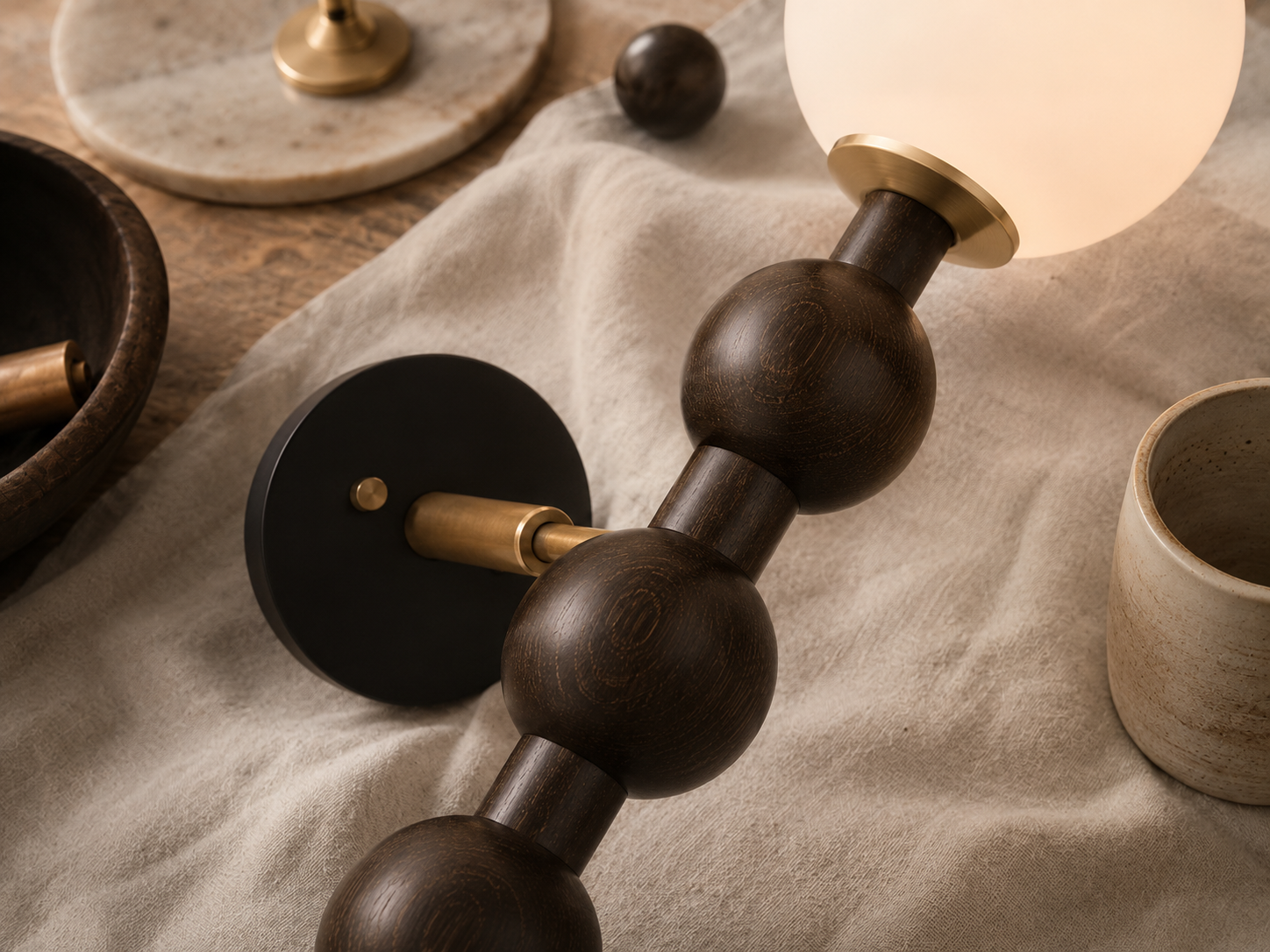 Natural materials and handcrafted details of Bubbly Beaded Globe Wall Lamp