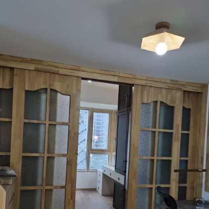 Light wood flush-mount ceiling light with frosted globe diffuser and angular shade