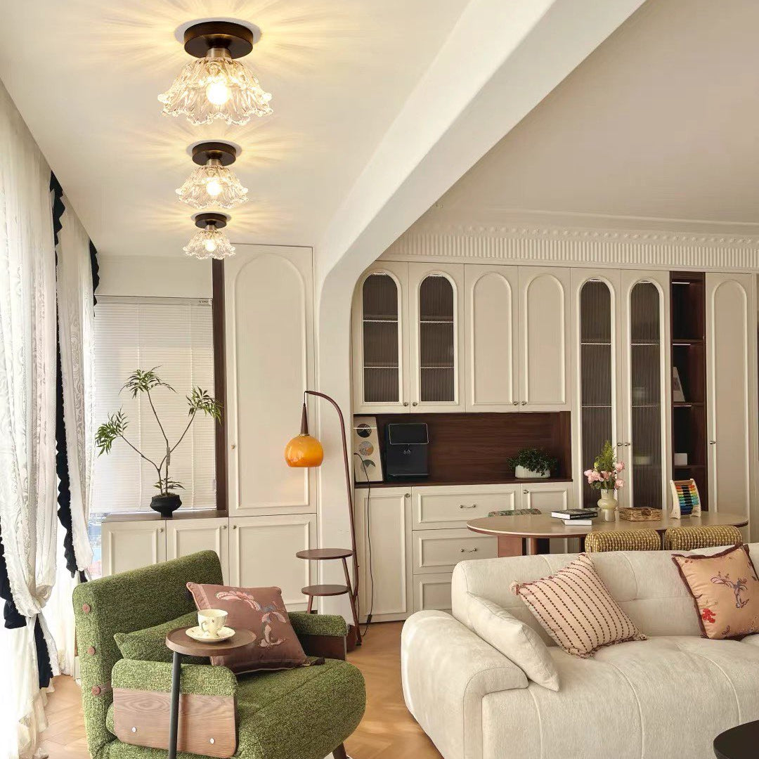 Semi-flush ceiling light with clear petal glass shade and dark bronze canopy
