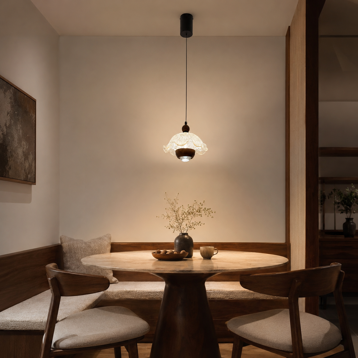 Fleur ruffle pendant light centered over dining table with frosted glass ruffled shade
