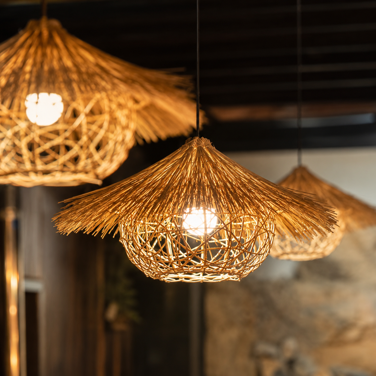 Close-up woven rattan pendant light with open lattice shade and warm illuminated bulb