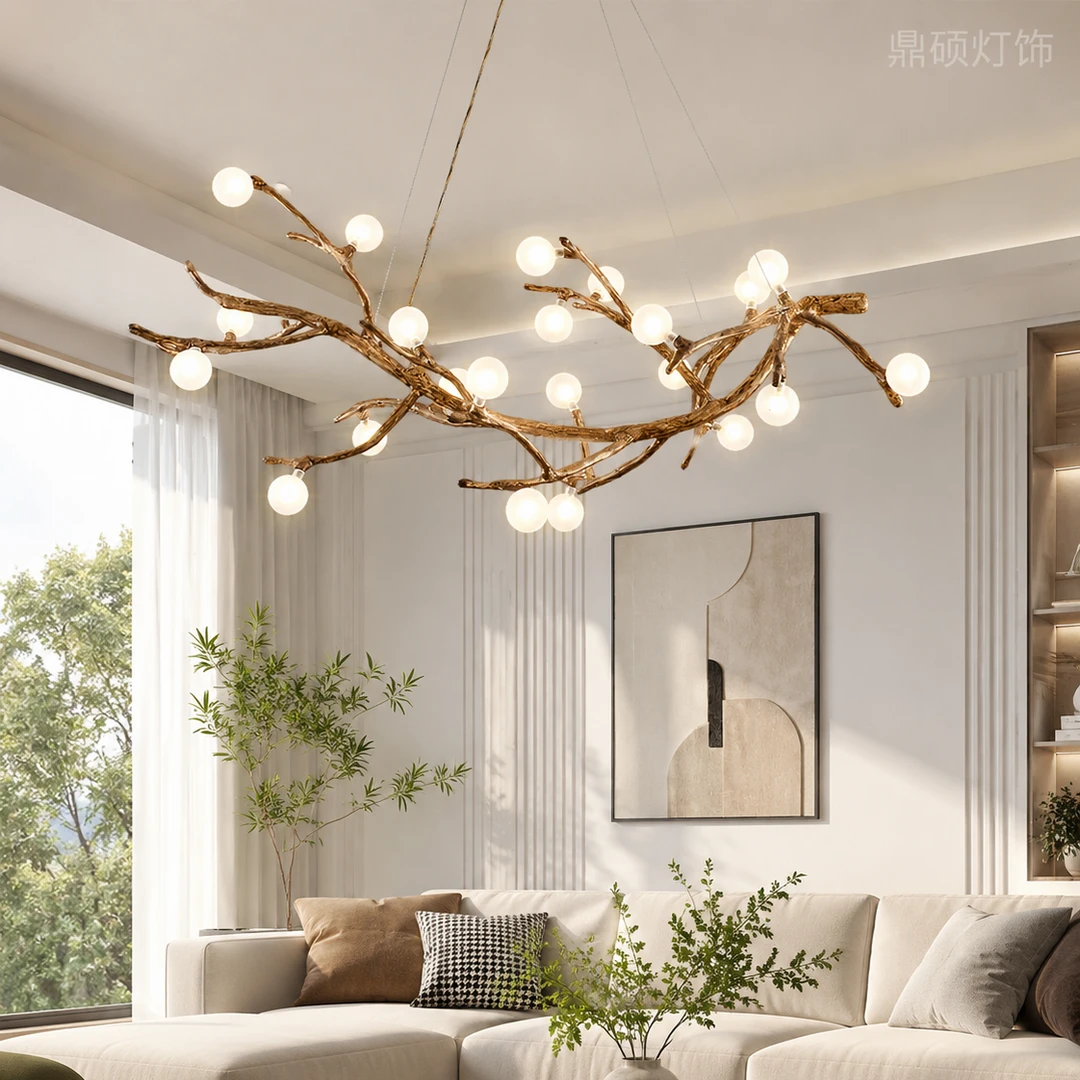 Gold branch chandelier with round globe bulbs, suspended from a central canopy.