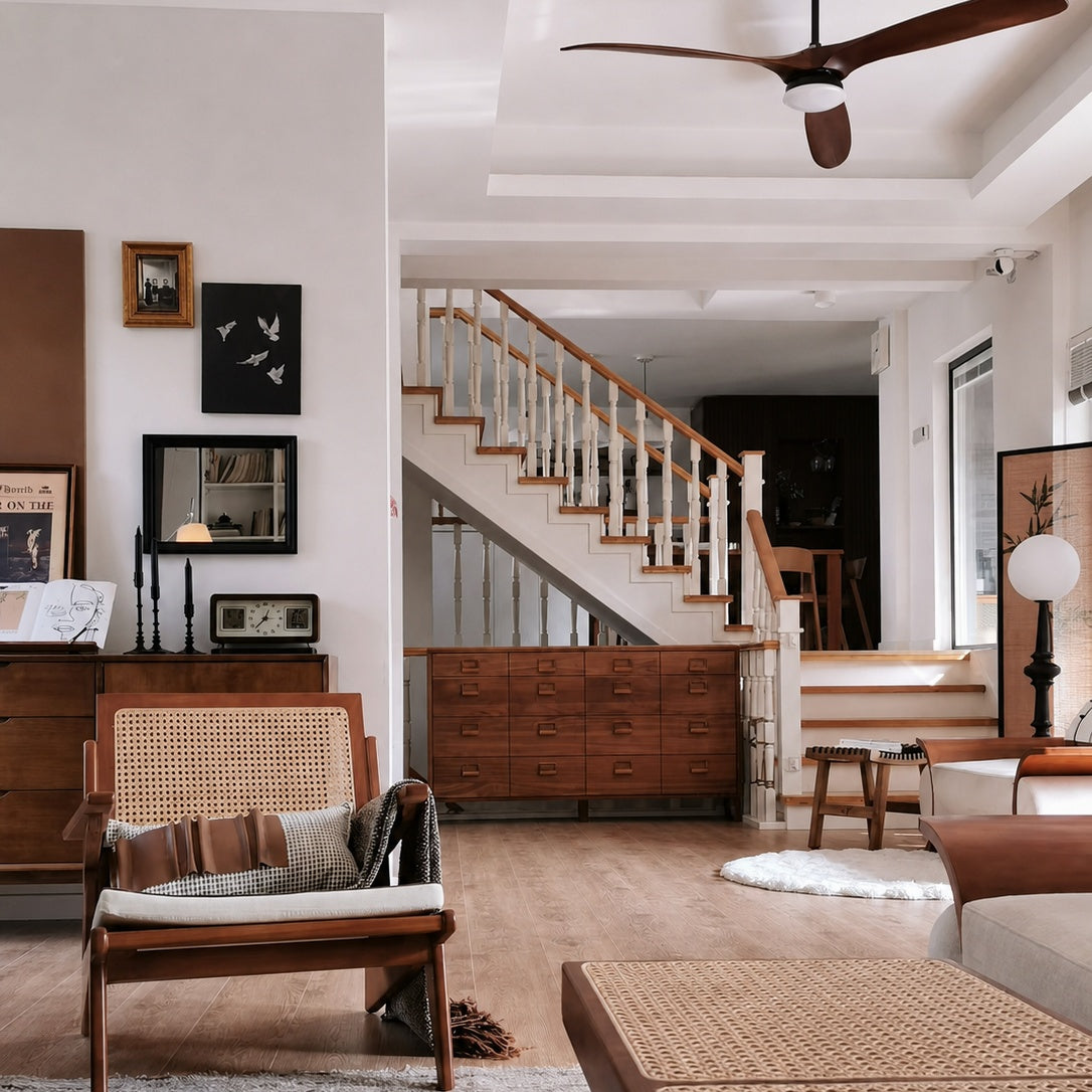 Ceiling fan with dark wood blades and frosted light dome on a black mounting