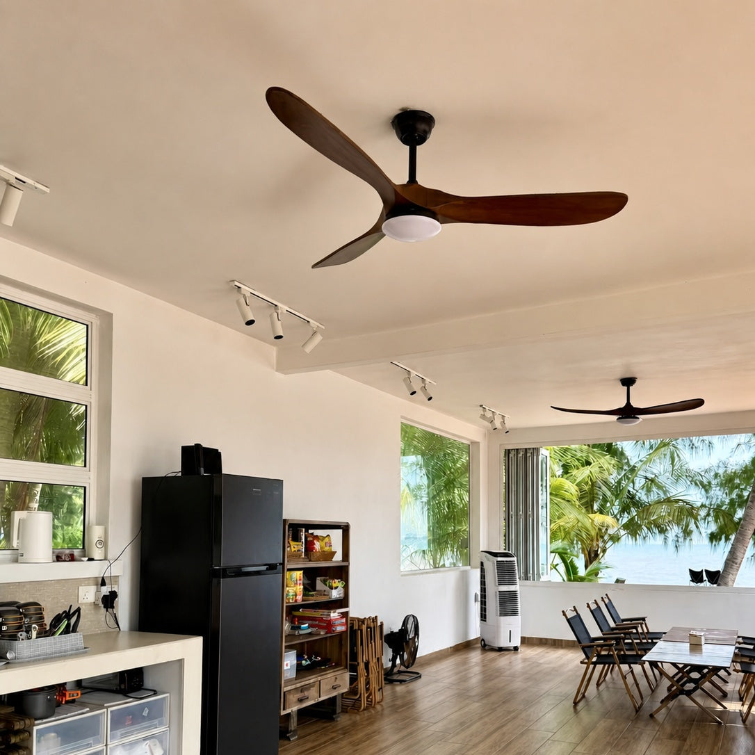 Ceiling fan with dark wood blades and frosted light cover mounted on black bracket