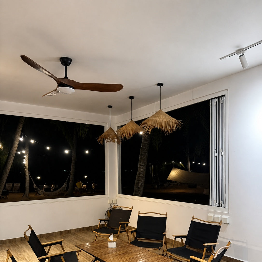 Ceiling fan with dark wood blades and frosted light cover on black ceiling mount